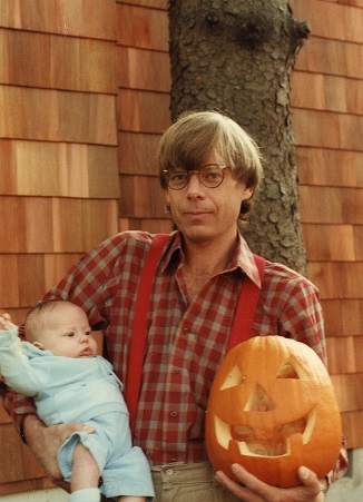 Dahlen holding baby and pumpkin