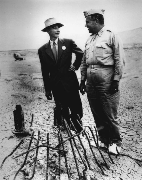 Robert Oppenheimer (left) and General Leslie Groves (right) at Ground Zero of the nuclear bomb test site. Circa 1945