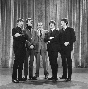 The Beatles stand with Ed Sullivan