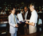 Herwig Schopper and Abdus Salam present Yoichiro Nambu with the 1986 Dirac Prize of the Abdus Salam International Centre for Theoretical Physics