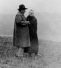 Albert Einstein and Marie Curie outdoors