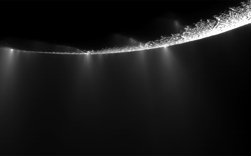A view of Saturn’s moon Enceladus emitting vapor plumes into space, captured by NASA’s Cassini probe in 2009.