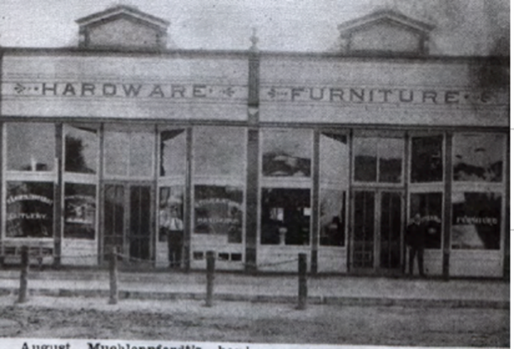 Black and white photo of hardware and furniture store