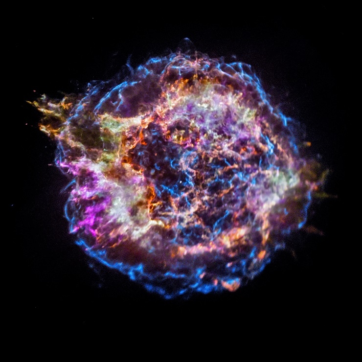 Cassiopeia - A supernova remnant. Each color reveals a different element created in the explosion: silicon (red), sulfur (yellow), calcium (green), iron (purple). The supernova blast wave is shown in blue. Credit: NASA/CXC/SAO