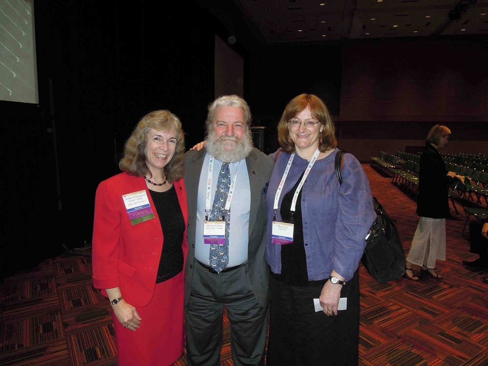 L to R: Elmegreen, Helfand, and Urry smiling at a conference group photo.