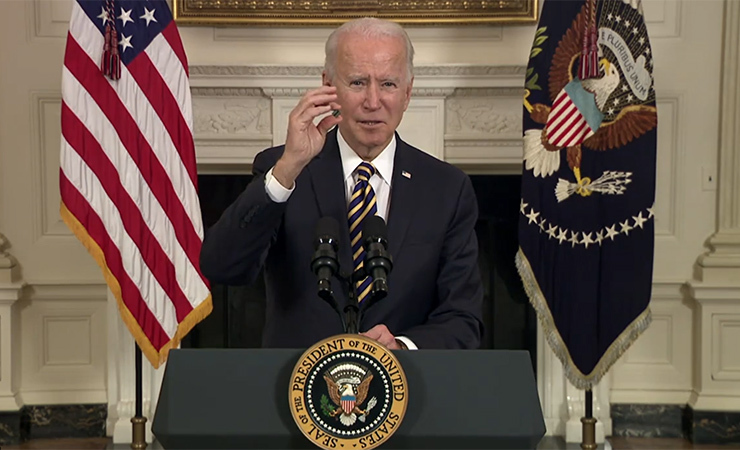 President Biden holds up a computer chip during remarks he made today before signing an executive order on strengthening supply chains.  (Image credit – The White House)