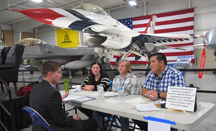 A candidate being interviewed at a 2019 science and engineering job fair at Hill Air Force Base in Utah. 
