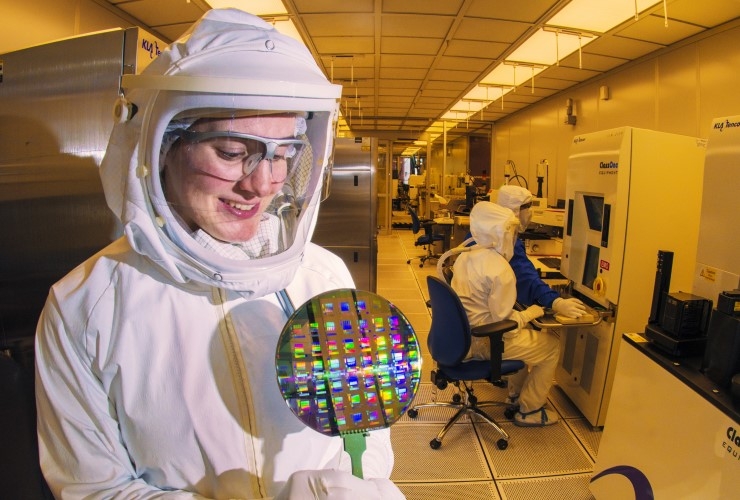 A scientist holds a silicon wafer