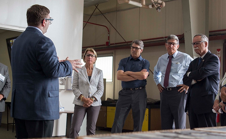 From left, Sen. Shelley Moore Capito (R-WV), Energy Secretary Rick Perry, Sen. Joe Manchin (D-WV), and Rep. David McKinley (R-WV) tour the Morgantown, West Virginia, branch of the National Energy Technology Laboratory. 