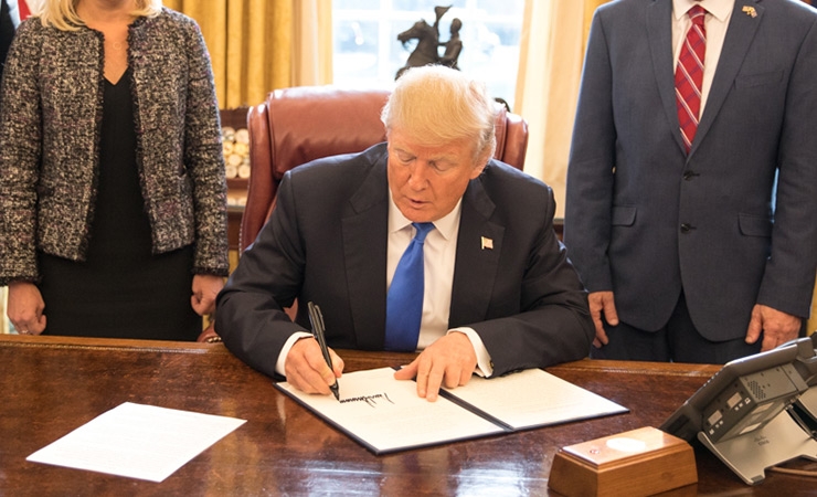 President Trump signing an executive order in January 2018.