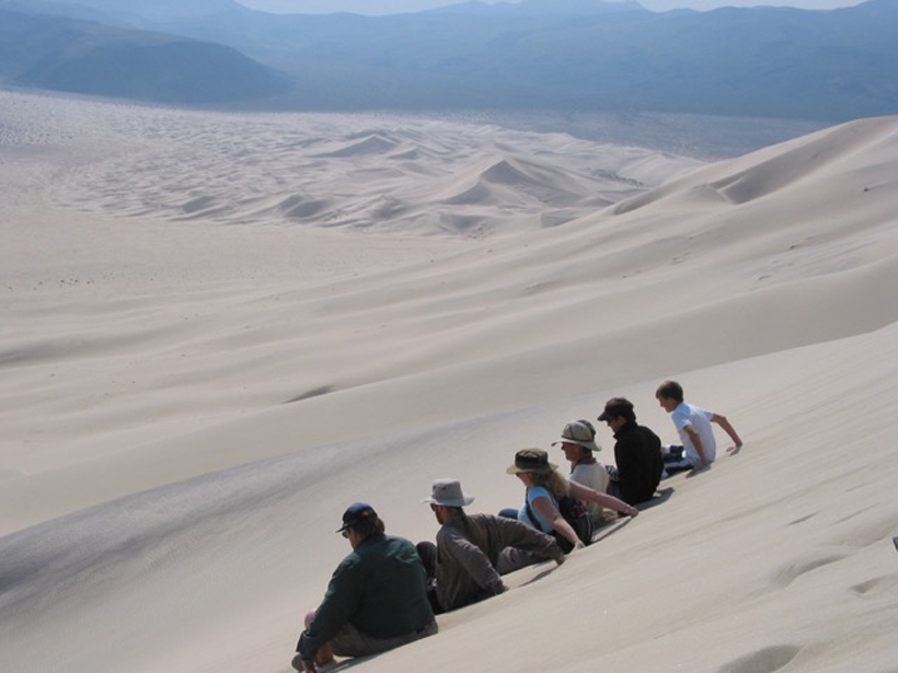 Sliding down on the seat of your pants and creating a large sand avalanche on the 200m-high Eureka Dune in Death Valley National Park, Calif.
