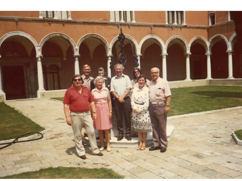 Group portrait of Margaret and Geoffrey Burbidge (front left), William Fowler (front right), Fred, Barbara, and&nbsp;Elizabeth Hoyle (center), and&nbsp;Donald Clayton and Martin Rees (rear left)&nbsp;at the monastery on the Isola St. George in Venice, Italy, 1975.&nbsp;