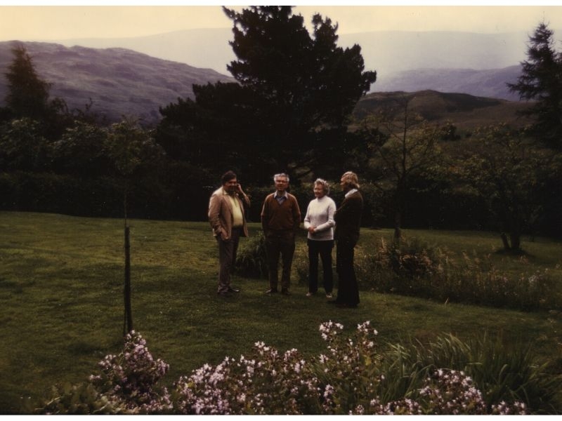 Geoffrey Burbidge, Fred Hoyle, Margaret Burbidge, and Donald Clayton in the garden at Hoyle's home
