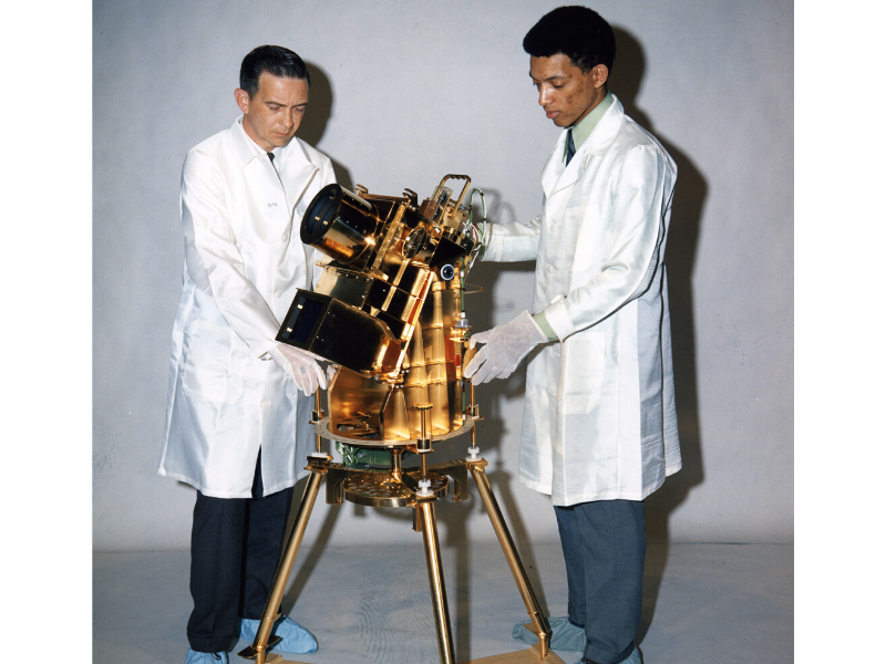 Project Engineer William Conway (left) and Principal Investigator Dr. George Carruthers (right) with the Apollo 16 Far Ultraviolet Camera/Spectrograph instrument.