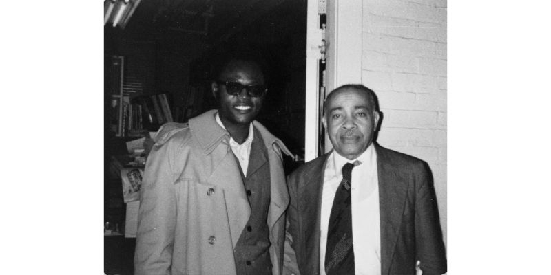 Photo of Warren Henry with a student.